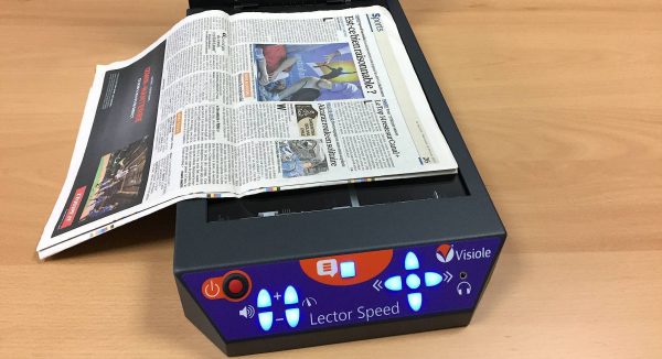 machine à lire Lector Speed avec un journal